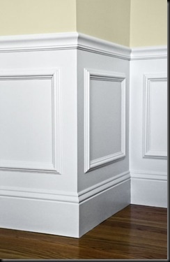 Create a wainscoting look by gluing picture frames to wall, then painting over entire lower wall. {organizedCHAOSonline}